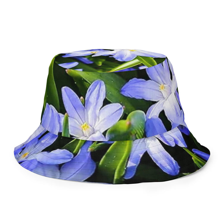Blue flower bucket hat with vibrant floral design and green leaves from bucket hat shop collection