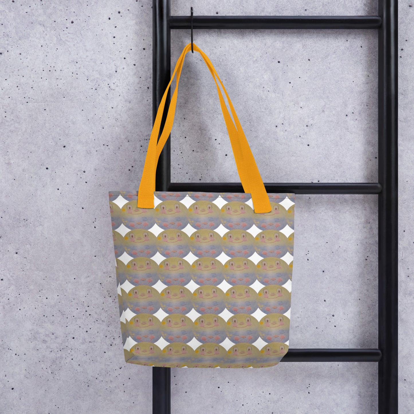 Beach tote bag with cartoon print SUNNY MOON PRINT featuring yellow straps hanging on black ladder