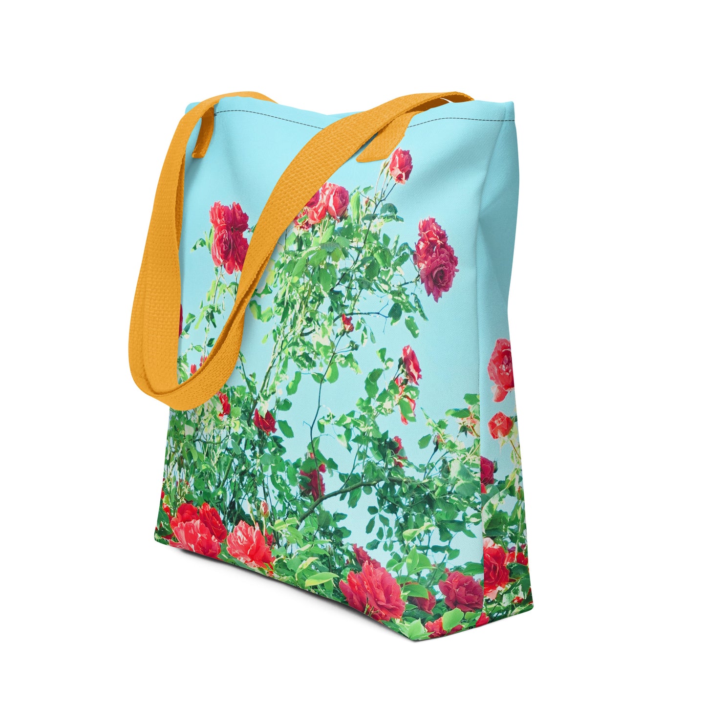 Blue tote bag with yellow straps featuring VINTAGE ROSE PRINT with red roses and green leaves
