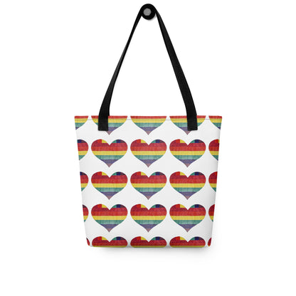 LGBT pride tote bag with rainbow heart pattern and black handles from NUSH'S STORE