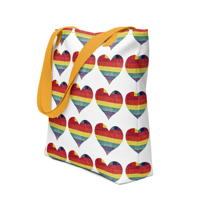 NUSH'S STORE LGBT pride tote bag with rainbow heart pattern and yellow straps on white background