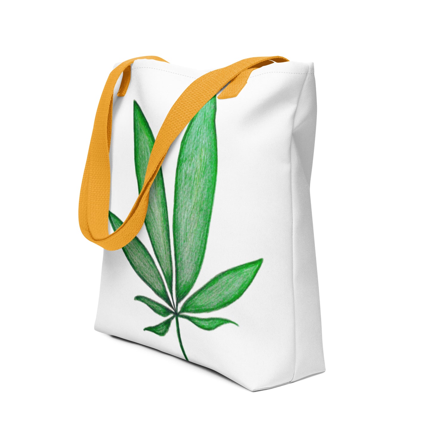 Canvas shopping tote with leaf design featuring green leaf print and orange handles