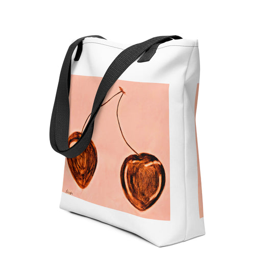 NUSH'S STORE cherry print tote bag with black straps and artistic cherry design on light pink background