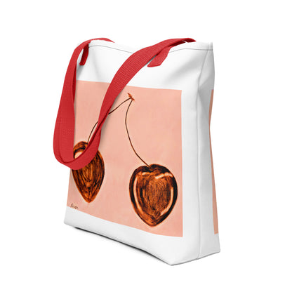 White cherry print tote bag with red handles featuring artistic cherry design from NUSH'S STORE