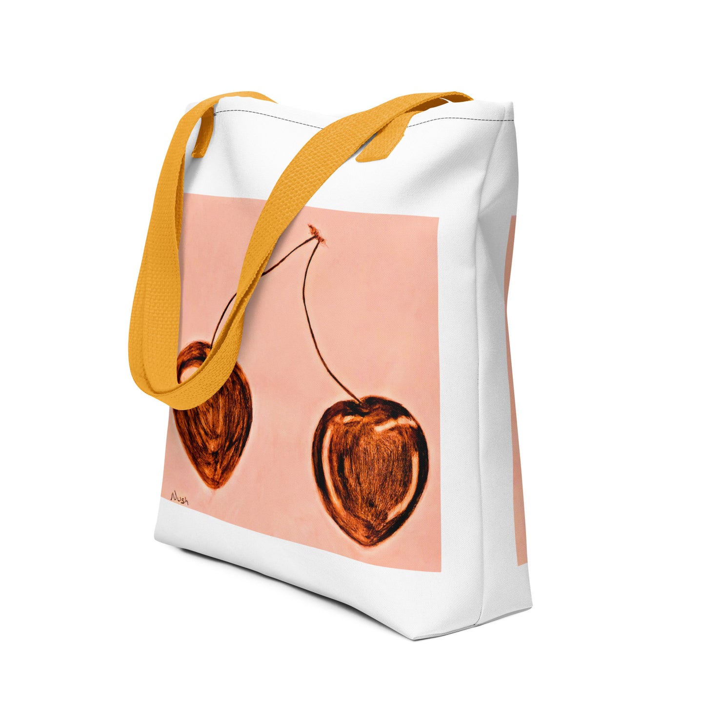 White cherry print tote bag with orange handles and artistic cherry design on front