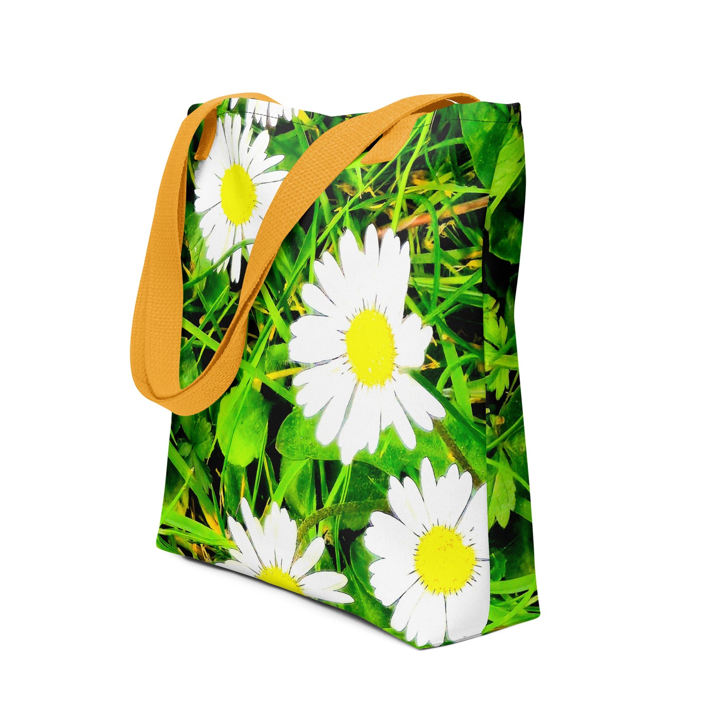 Daisy print tote bag with yellow straps featuring white daisies on green grass background