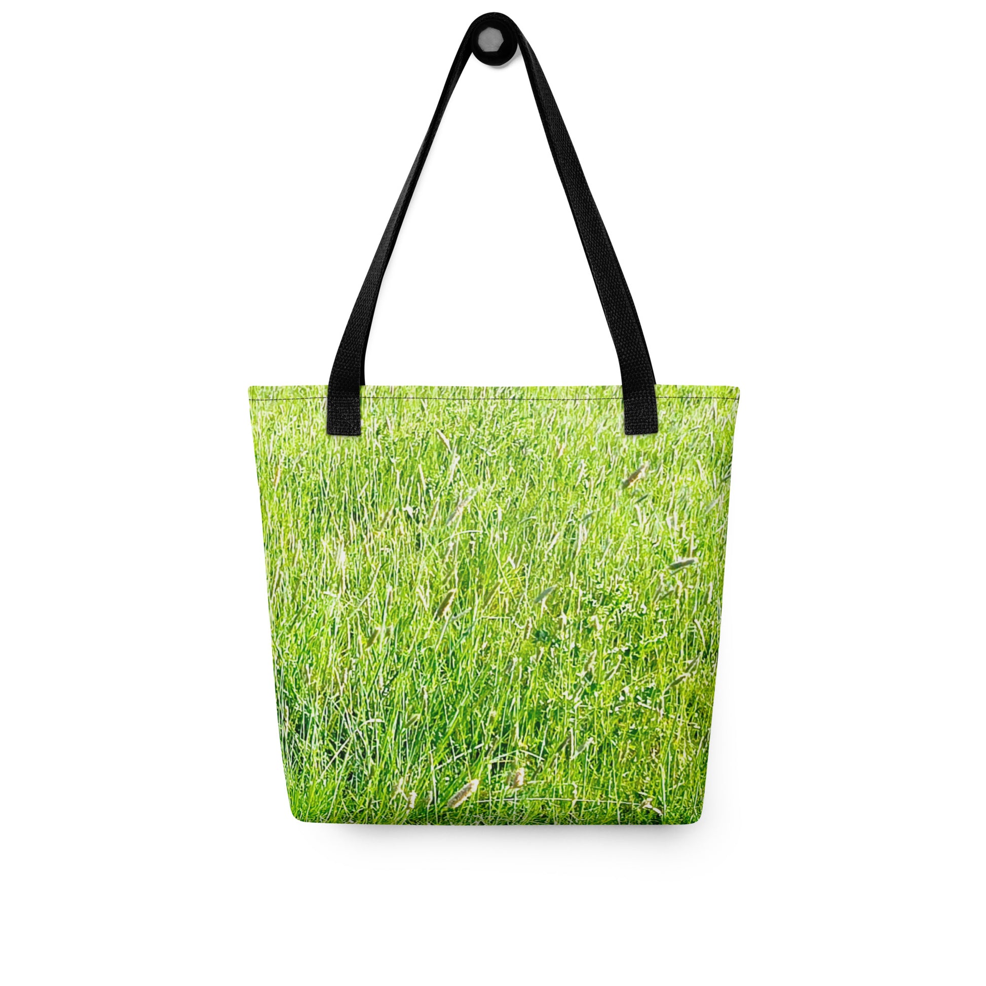 NUSH'S STORE grass print tote bag with black handles featuring a vibrant green grass design