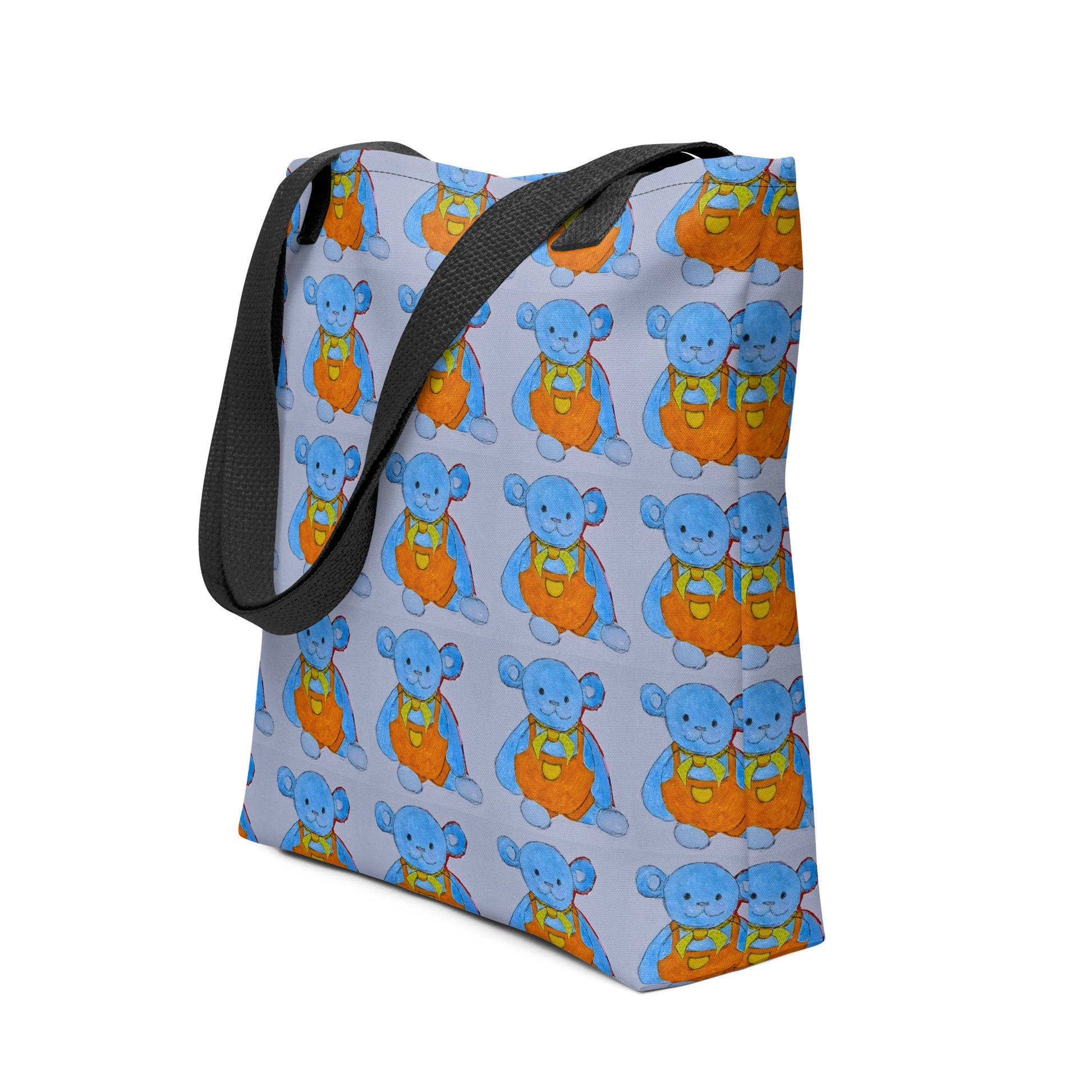 Kids teddy bear tote bag with blue and orange bear pattern and black shoulder straps