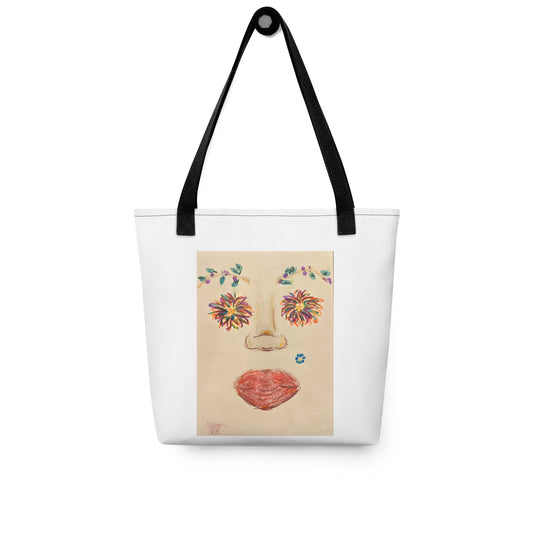 Large canvas tote with face print featuring colorful floral eyes and red lips with black handles