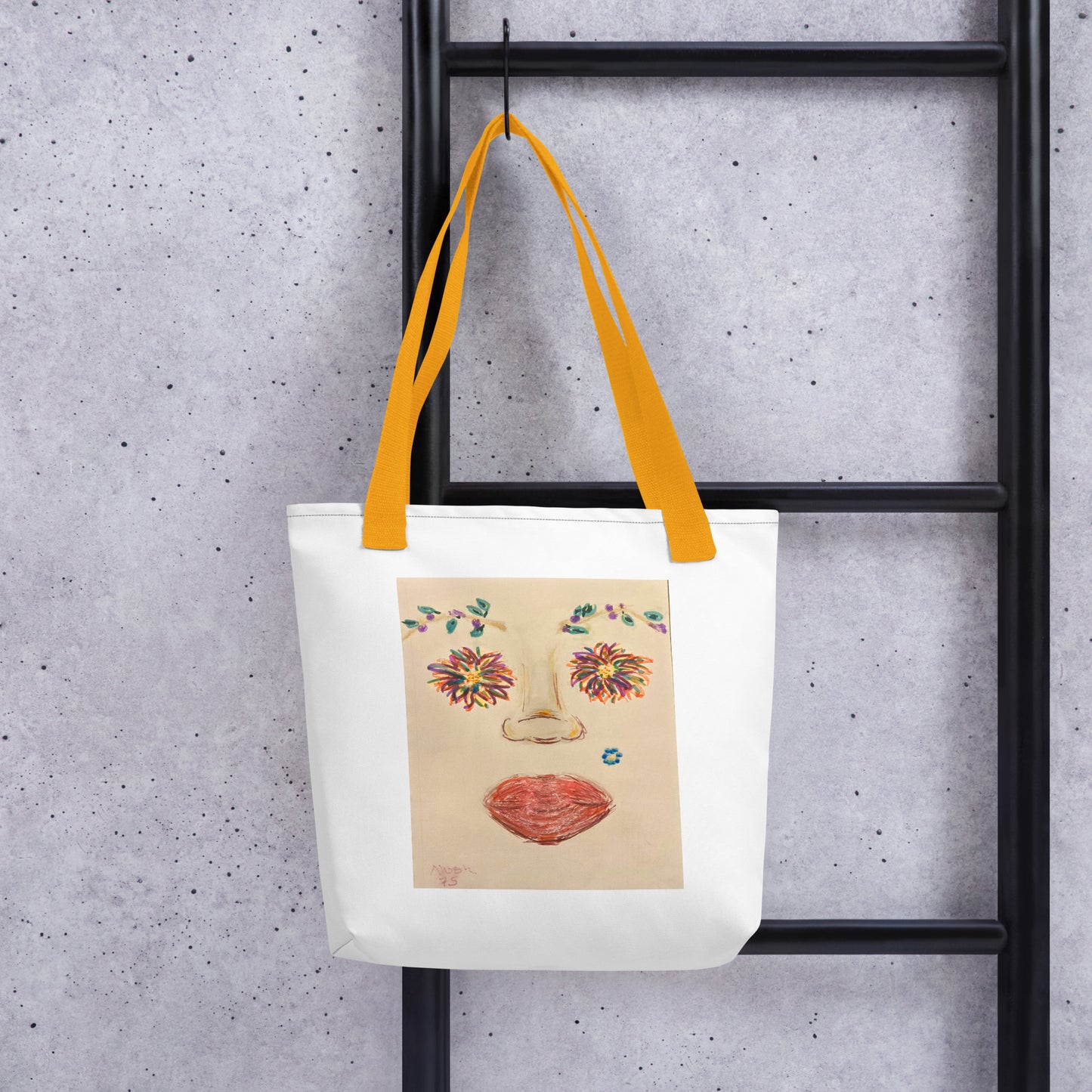 Large canvas tote with face print featuring floral eyes and orange lips with yellow handles