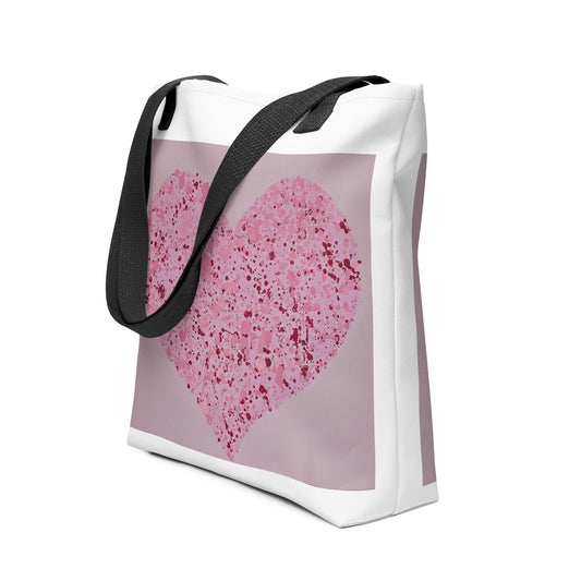 Large canvas tote with heart print in pink and purple tones with black shoulder straps