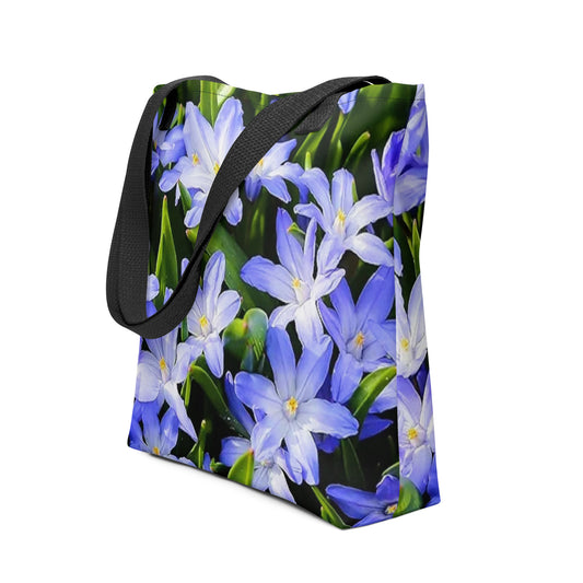 Large floral print tote bag with vibrant blue and white flowers and black shoulder straps