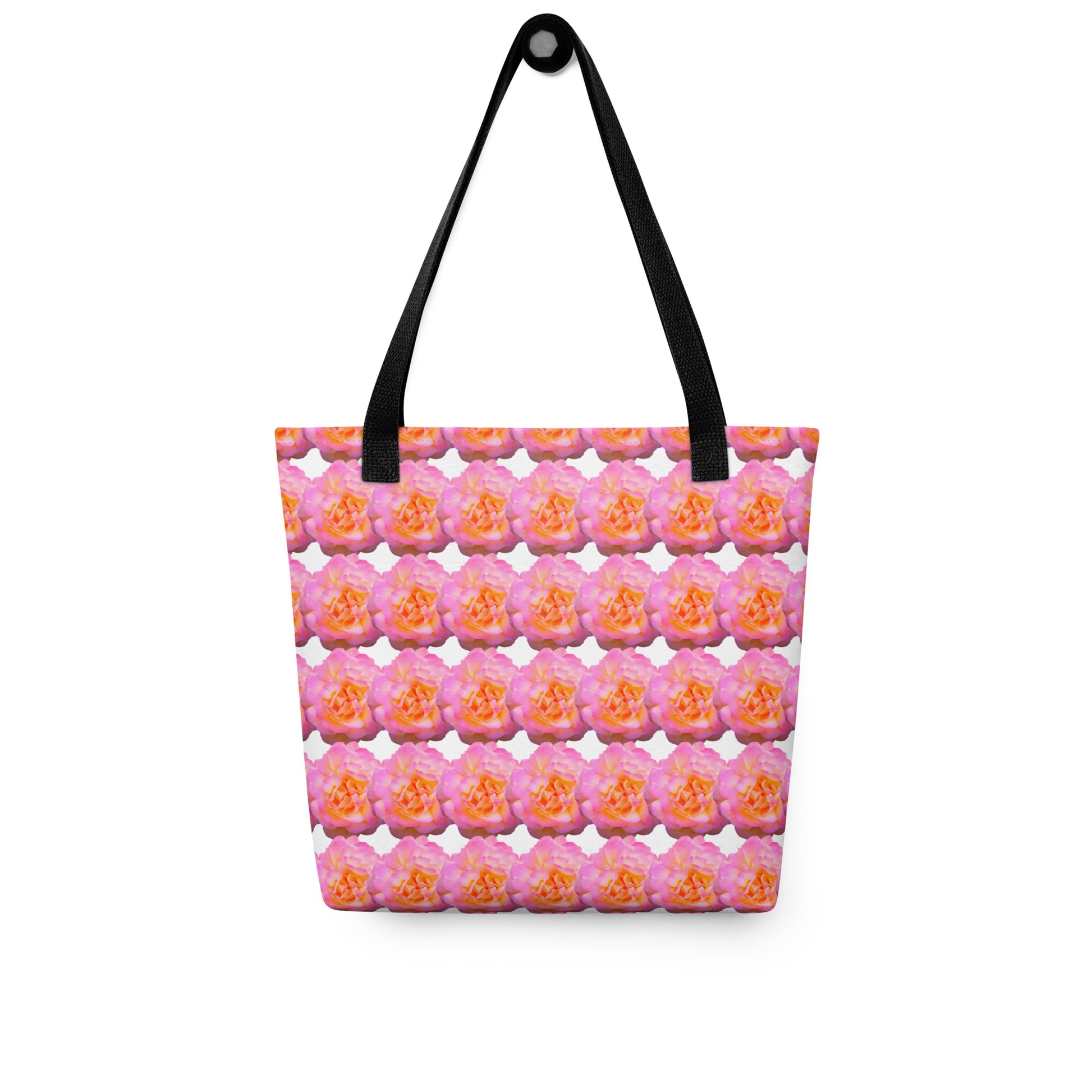 Pink flower print tote with black handles featuring vibrant orange and pink floral pattern