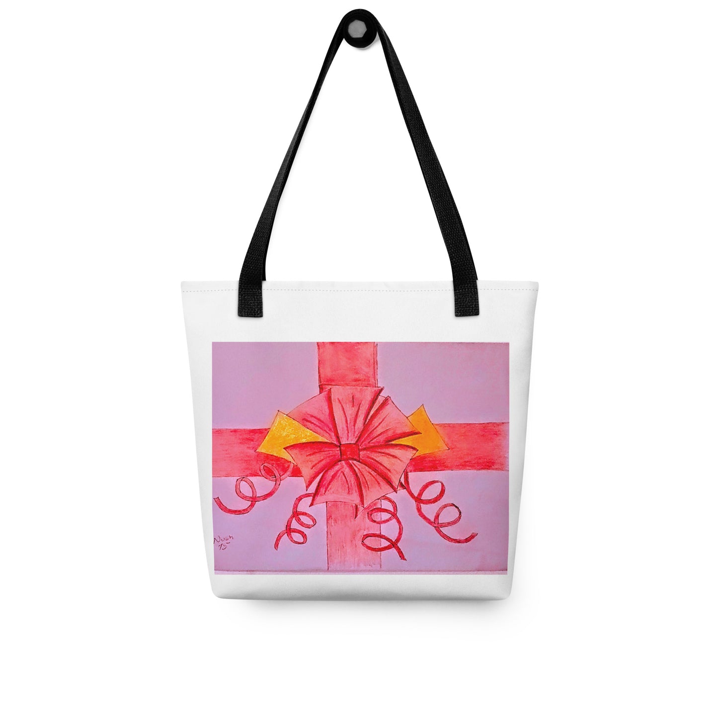 White tote bag with black straps featuring a pink ribbon gift tote design with red and yellow bow accents
