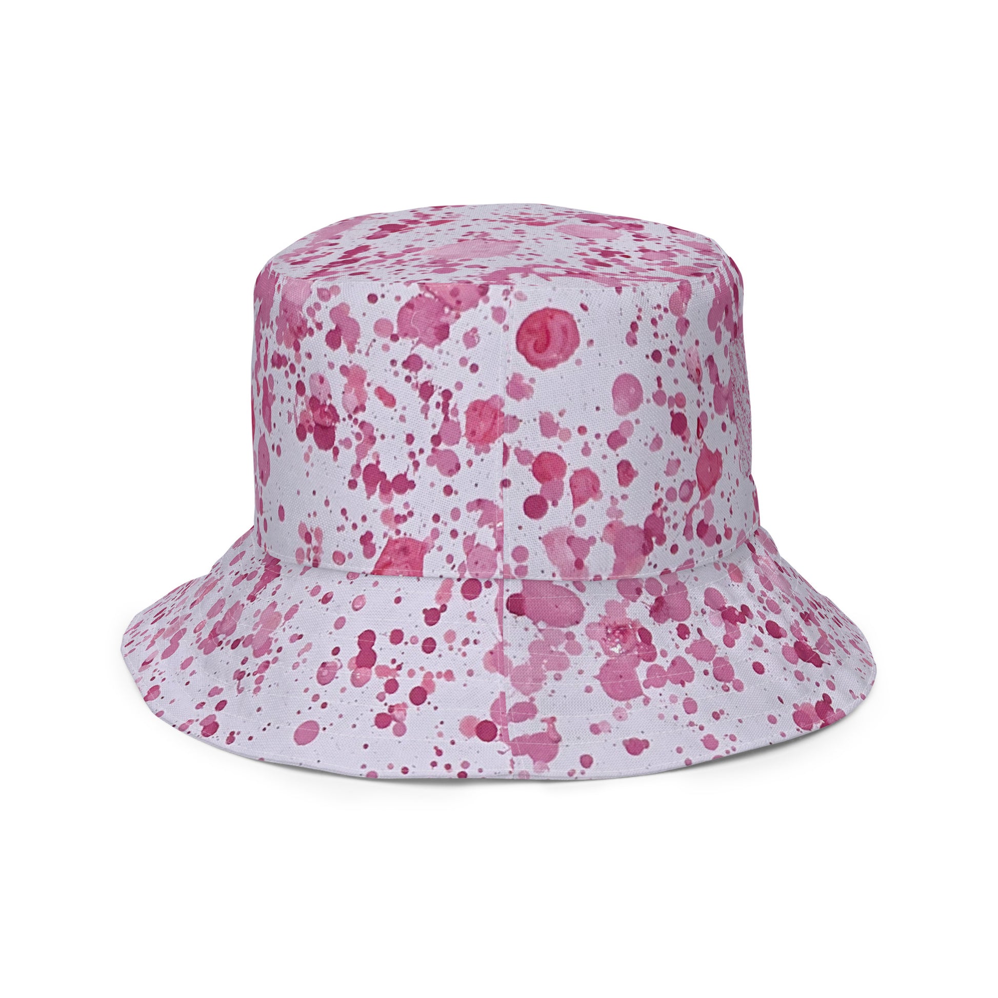 Pink splatter bucket hat from NUSH'S STORE with vibrant festival hat design