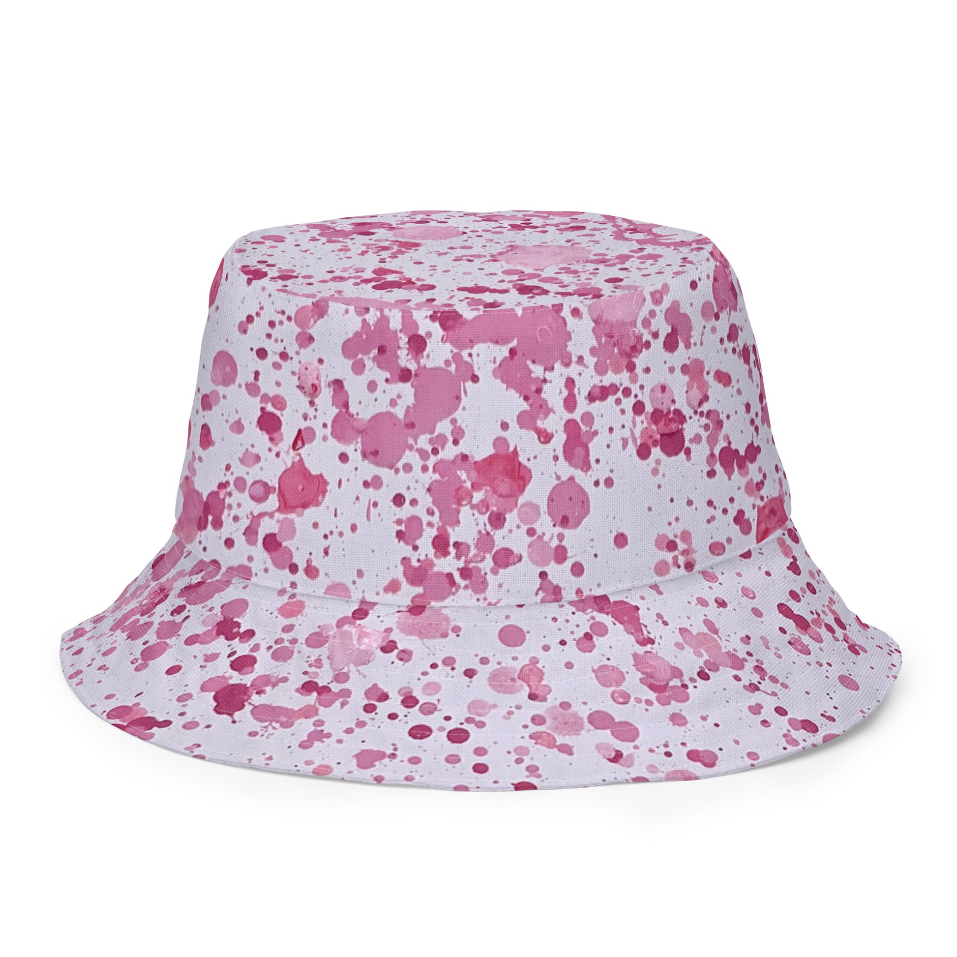 Pink splatter bucket hat with all-over paint splatter design from NUSH'S STORE festival hat collection
