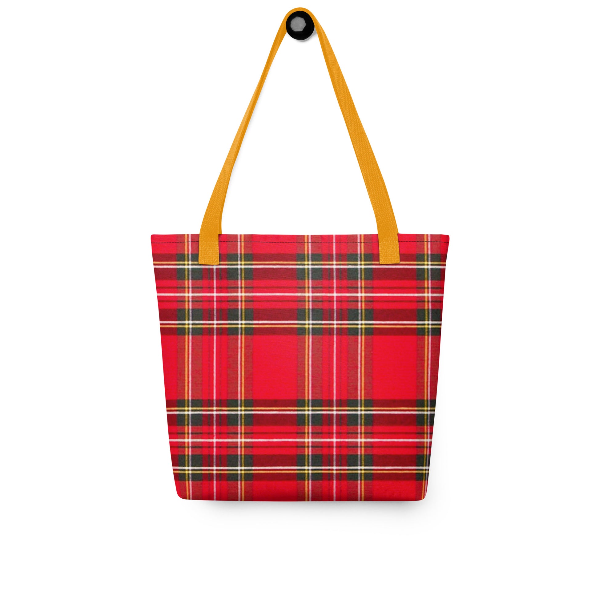 Red plaid shoulder bag for summer with yellow straps hanging on white background