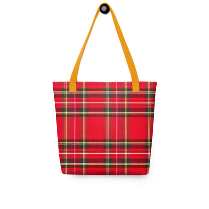 Red plaid shoulder bag for summer with yellow straps hanging on white background