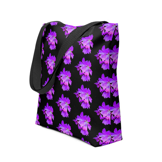 Black tote bag with vibrant purple flower print tote design and sturdy black strap