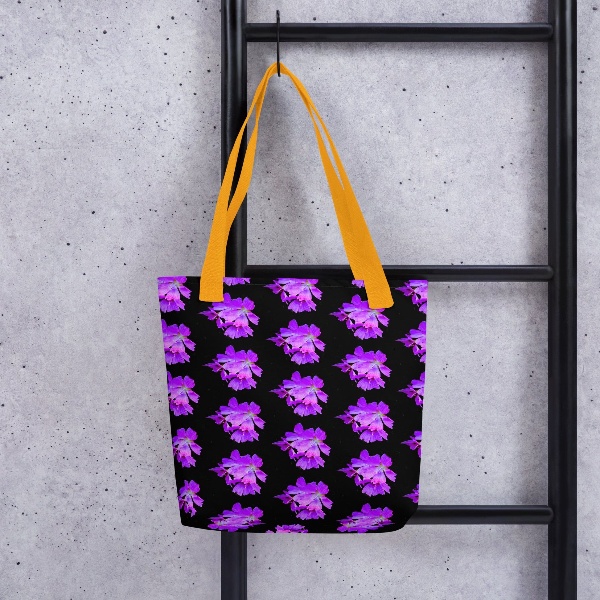 Purple flower print tote with vibrant purple flowers on black background and yellow handles