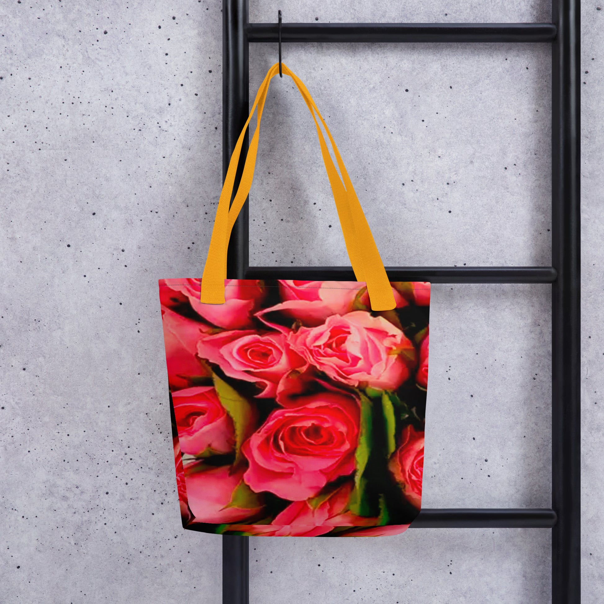 NUSH'S STORE rose print shopping bag with vibrant pink rose design and yellow handles hanging on black ladder